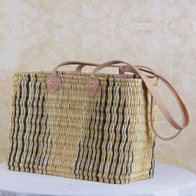 Wicker basket with long leather handles